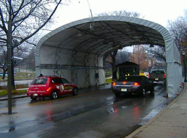 car passing through tunnel under open sky